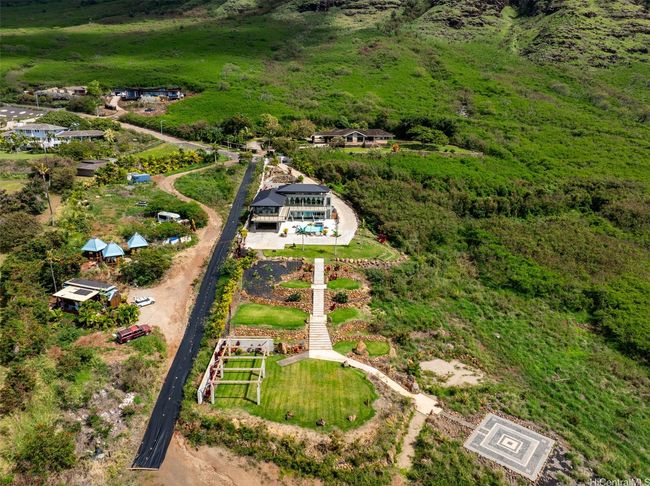 Here you can see nearly all of the 2.009 acre lot with plenty of greenery, this is not the full acreage shown, but there is room here to add a second structure on the lower acre! The black tarp area is also part of this property. | Image 21