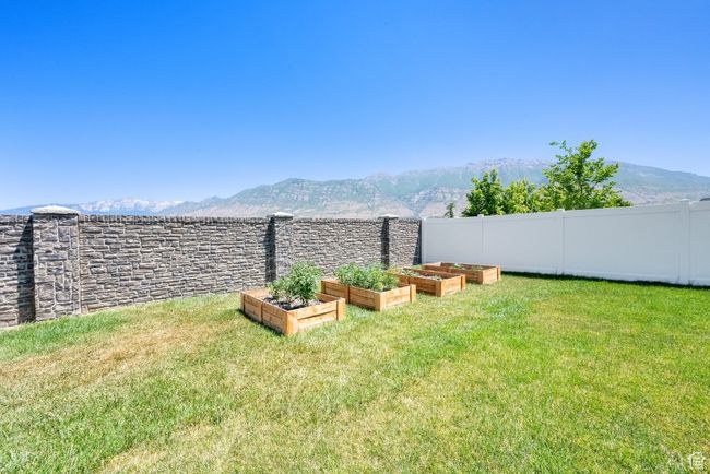 View of yard featuring a garden and a mountain view | Image 34