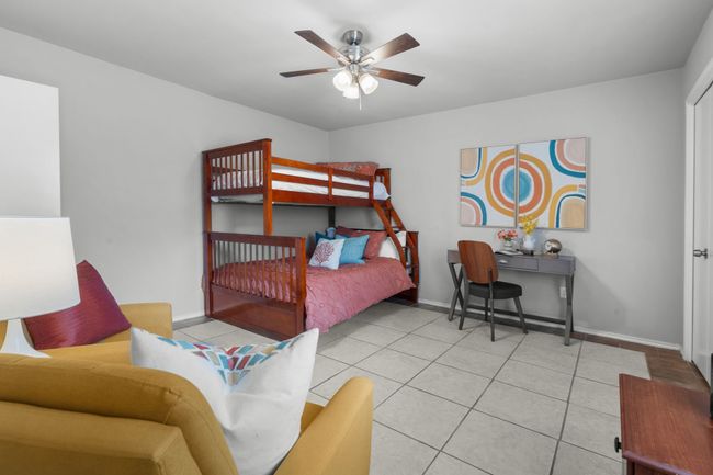 Bedroom featuring baseboards, tile flooring, and ceiling fan | Image 19