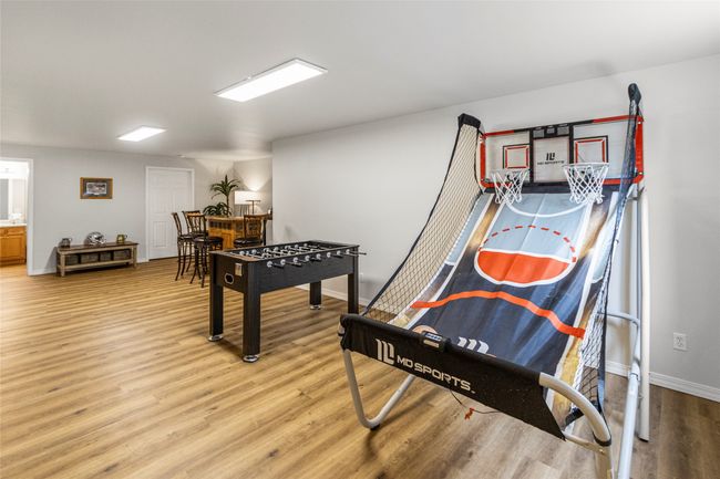 Playroom with light wood finished floors and baseboards | Image 34