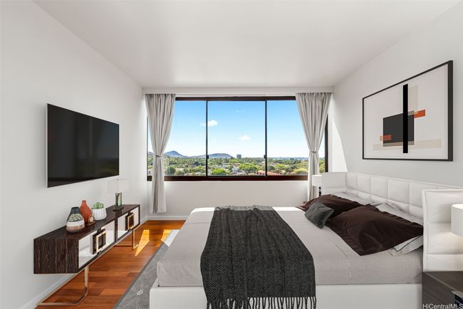 Bedroom features hardwood floors, UV protected automated blinds, blackout curtains and views of Koko Head! Virtually Staged(enhanced) | Image 11