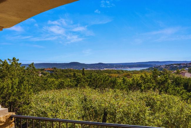 Enjoy the gorgeous second floor balcony view of Lake Travis during the day. | Image 21