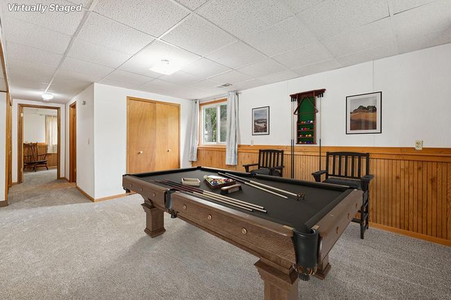 Virtually staged family room area on the lower level | Image 16