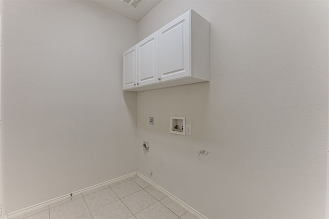 separate laundry room with storage closet | Image 27