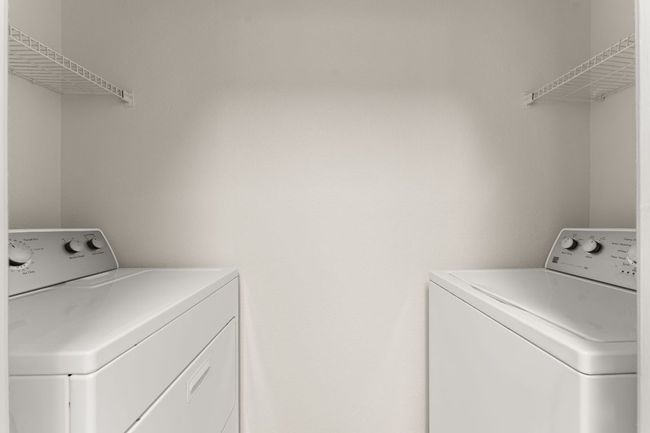 Clothes washing area with washer and dryer and laundry area | Image 11