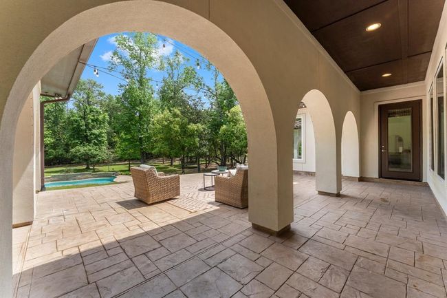 Step into your back yard oasis, with incredible arches, mature trees, pool, spa and outdoor kitchen! | Image 34