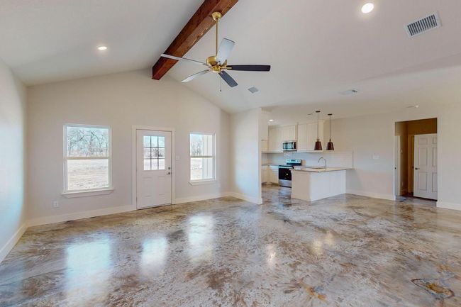 Unfurnished living room with ceiling fan and recessed lighting | Image 9