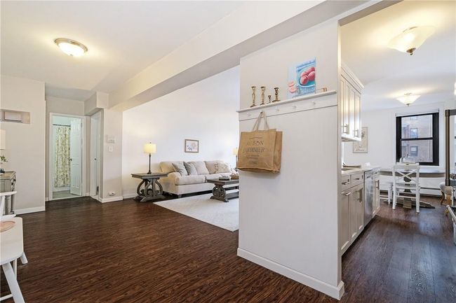 View from entryway looking through kitchen and toward living room. | Image 6