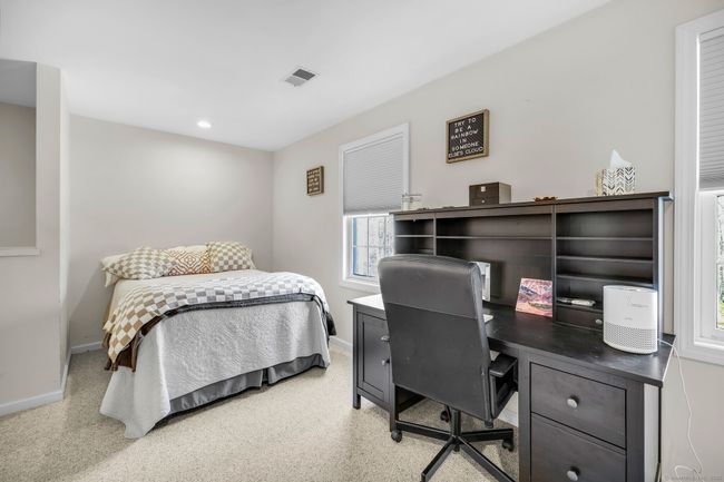 Bonus room with wall-to-wall carpet, ceiling fan, and storage space. | Image 25