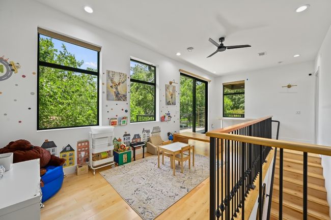 Second living area with access to second story balcony. | Image 18