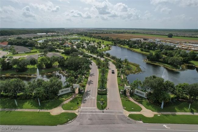 Aerial view of property and surrounding area with a large body of water | Image 33