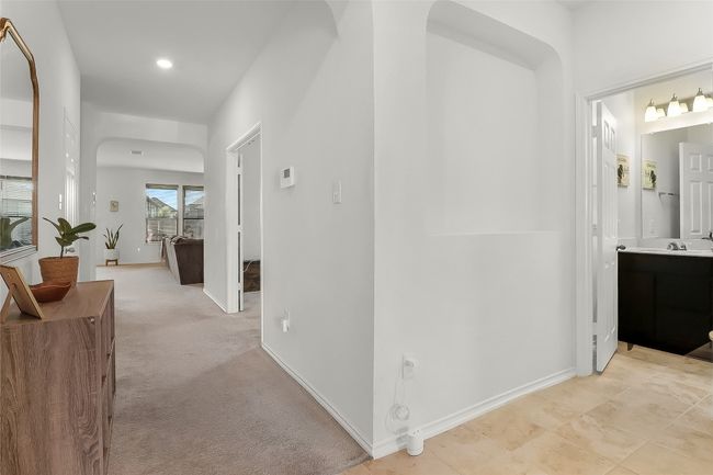 Hallway featuring baseboards, recessed lighting, and a sink | Image 6