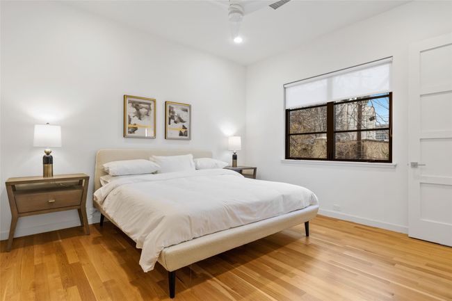 Bedroom featuring baseboards and light wood-type flooring | Image 25