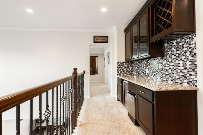 Wet bar upstairs. | Image 33