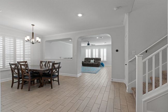 View of the dining room and the family room beyond it | Image 6