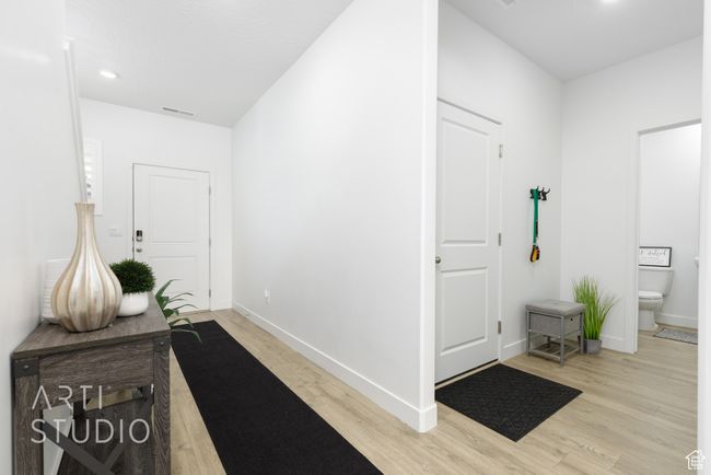 Entryway with light wood-style floors, recessed lighting, visible vents, and baseboards | Image 5