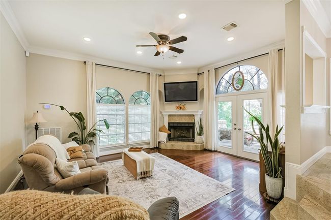Enjoy stunning backyard views from the inviting family room. | Image 5