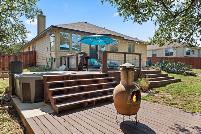 Wooden terrace featuring a hot tub | Image 25