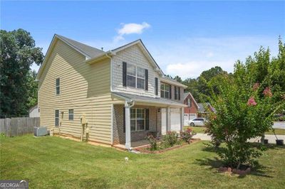 5675 Star Flower Drive, House other with 5 bedrooms, 3 bathrooms and null parking in Ellenwood GA | Image 2