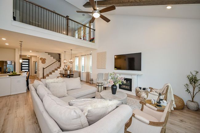 Stunning living room view showcases the open-concept design and soaring vaulted ceilings - capturing the essence of luxury living. | Image 12