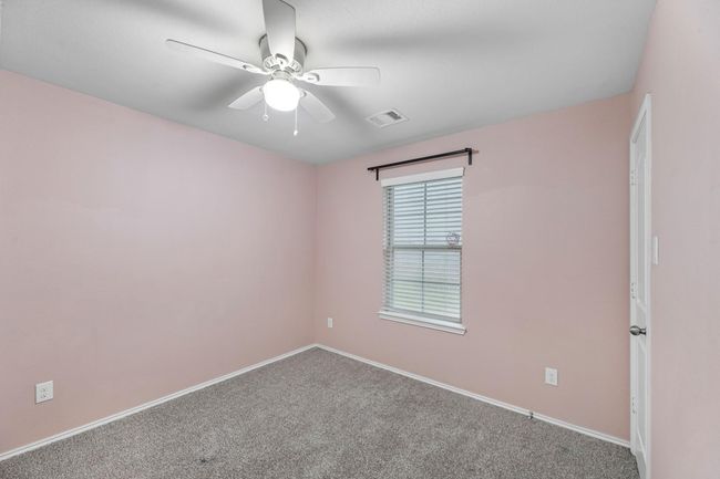 The second bedroom is at the end of the hall with views of the front yard. | Image 38