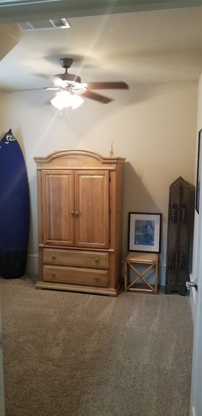 This room is downstairs and can be a study or office or bedroom. Only closet in this room is under the stairs. | Image 14