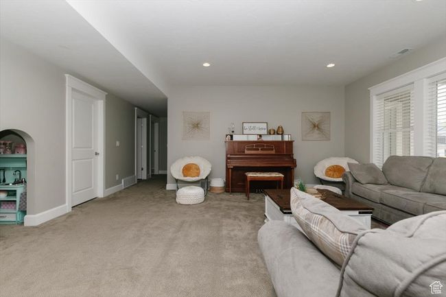 Living room with light carpet, baseboards, visible vents, and recessed lighting | Image 60