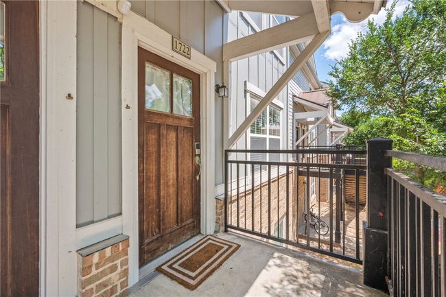 View of exterior entry with board and batten siding | Image 15