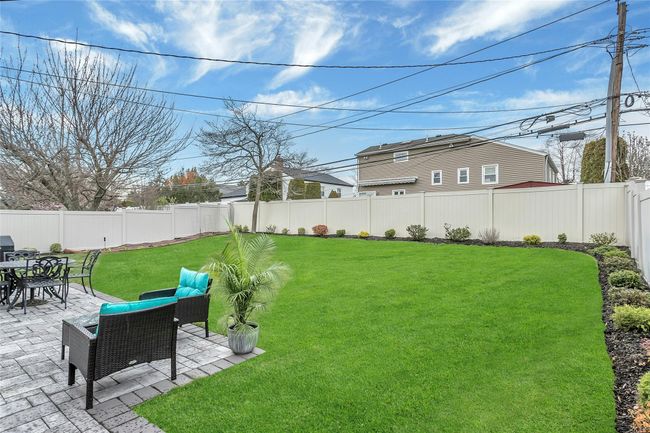 View of yard featuring a patio area and a fenced backyard with beautiful Landscaped Property | Image 26