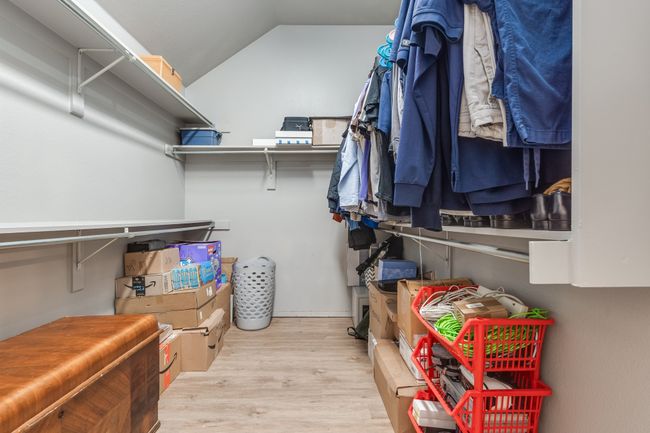 Spacious closet featuring wood finished floors and vaulted ceiling | Image 31