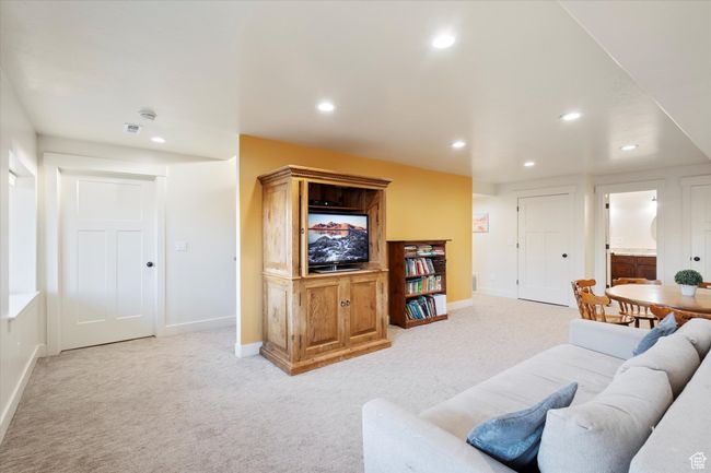 Living room featuring light carpet, recessed lighting, and baseboards | Image 29
