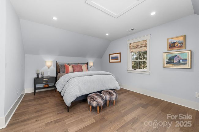 Cozy guest suite on the upper level. | Image 19