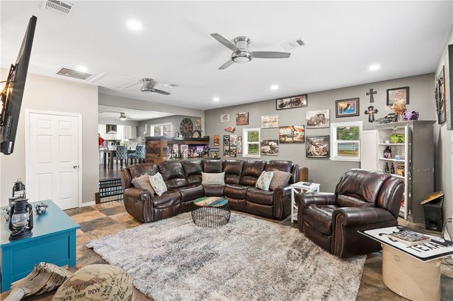 Living area featuring ceiling fan, attic access, and recessed lighting | Image 27