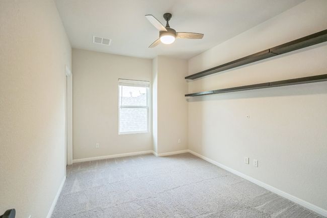 Spare room with carpet, ceiling fan, and baseboards | Image 15