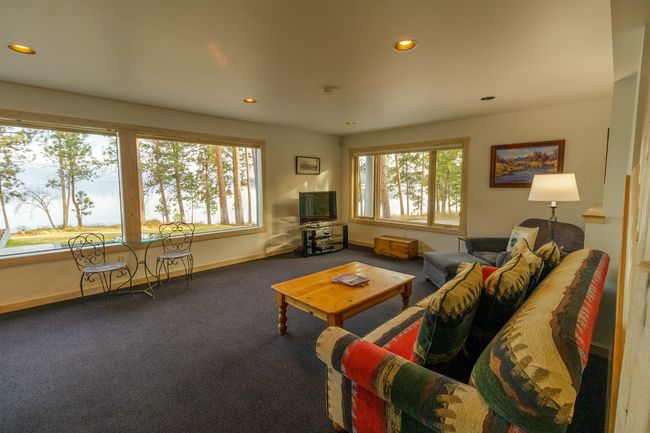 View of carpeted living room | Image 36