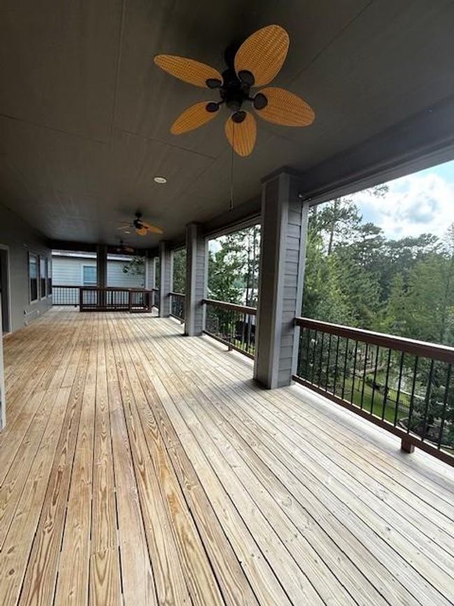 The expansive upper porch includes ceiling fans, and an unbelievable view of your surroundings. Ideal for relaxation and entertaining. | Image 33