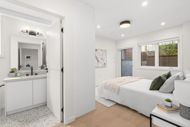 Bedroom with baseboards, a sink, light wood-type flooring, and recessed lighting | Image 13