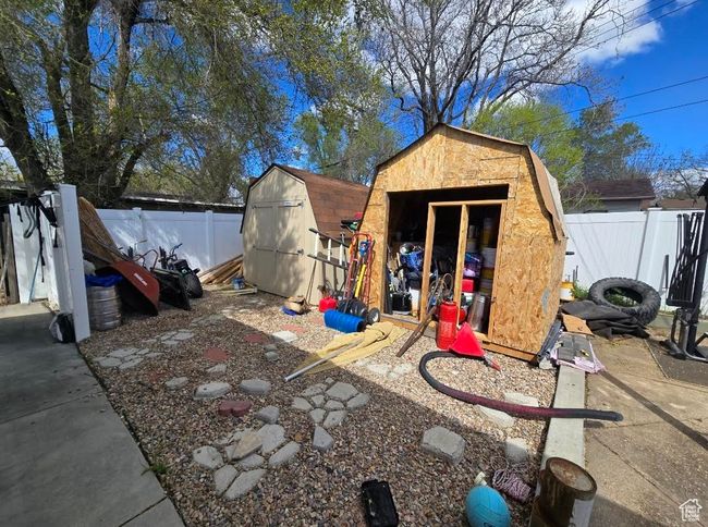 View of shed featuring a fenced backyard | Image 18