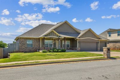 Craftsman-style home with a garage, a front yard, and a porch | Image 2