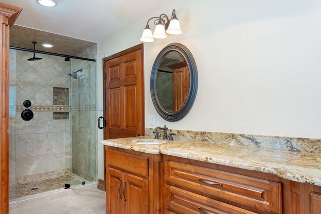Bathroom with a shower stall, vanity, and recessed lighting | Image 25