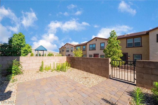 View of patio featuring a gate and a residential view | Image 5