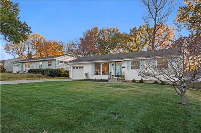 Single story home with a front yard and a garage | Image 3