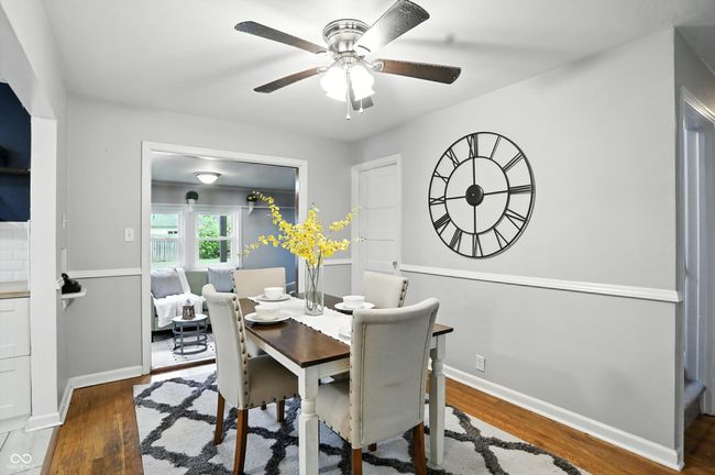dining area with wood finished floors and a ceiling fan | Image 9