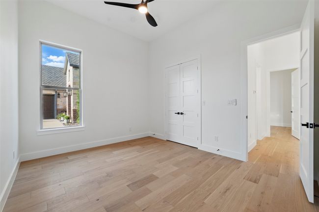 Unfurnished bedroom with a ceiling fan, a closet, baseboards, and light wood-type flooring | Image 20