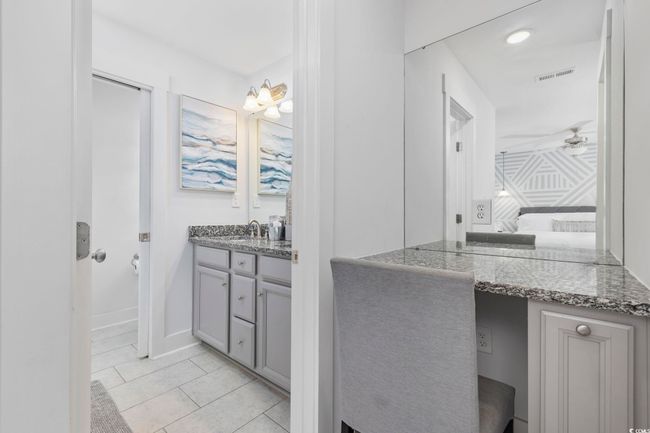 Ensuite bathroom with tile patterned flooring, visible vents, vanity, connected bathroom, and ceiling fan | Image 30