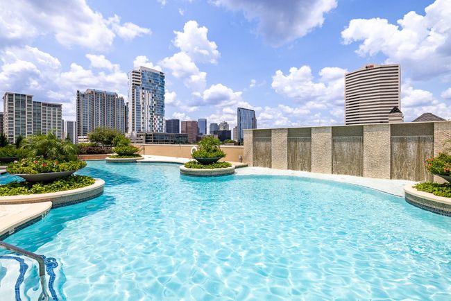 Stunning pool area with breathtaking city views. | Image 4