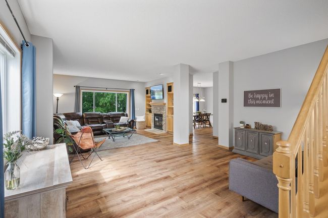 Huge main floor, with multiple gathering areas, and large windows. | Image 6