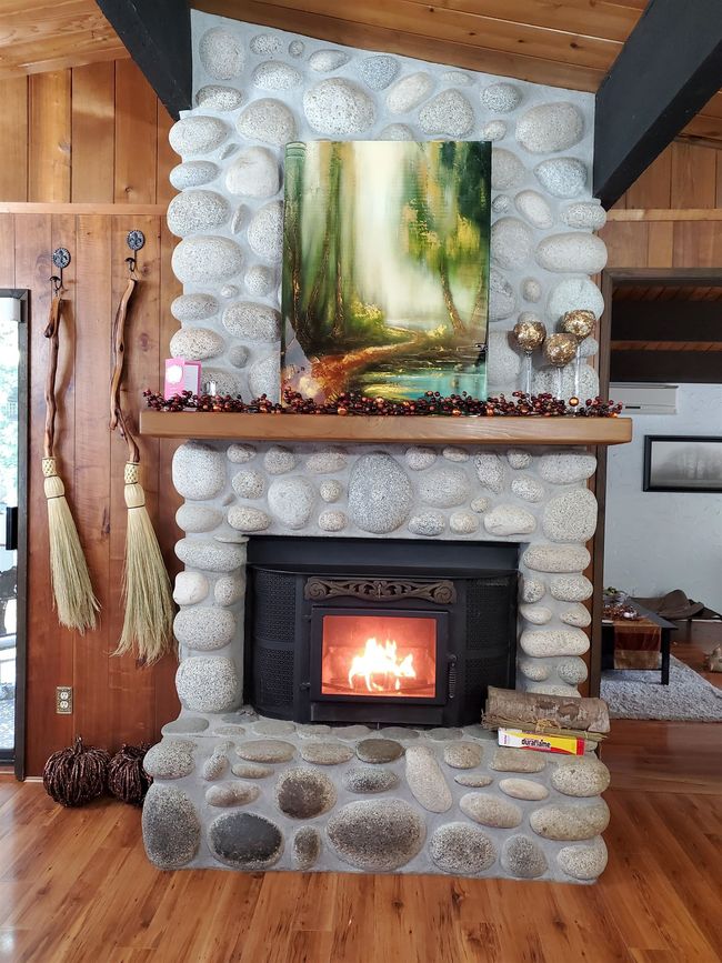 Interior details featuring a fireplace and wood finished floors | Image 10