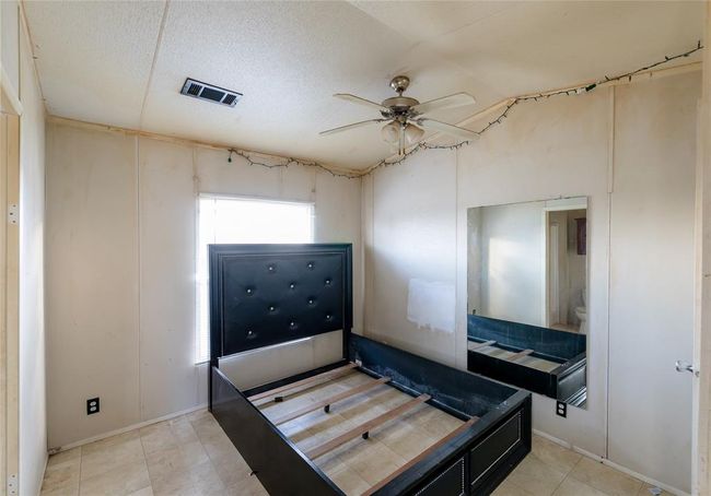 Bedroom featuring ceiling fan | Image 6