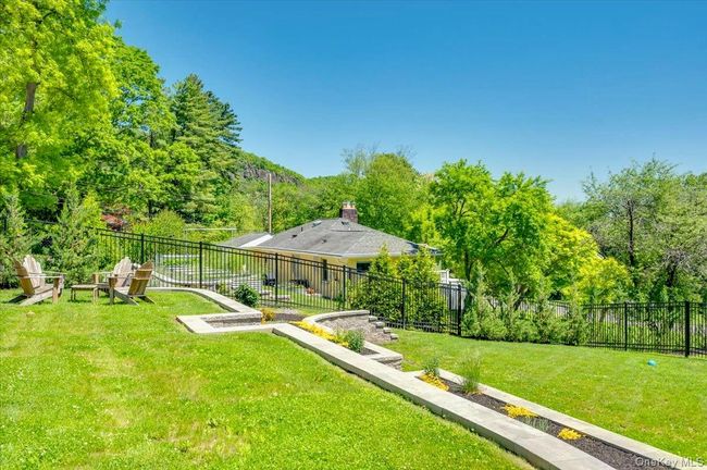 View of yard featuring a view of trees | Image 39